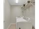 Laundry room with washer, dryer, and overhead shelving at 336 Del Sol Ave, Davenport, FL 33837