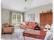 Living area features a plush sofa and an inviting atmosphere at 336 Del Sol Ave, Davenport, FL 33837
