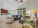 Open living room with high ceilings, comfortable seating and kitchen view at 336 Del Sol Ave, Davenport, FL 33837
