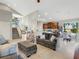 Spacious living area with high ceilings, open floor plan, and kitchen access at 336 Del Sol Ave, Davenport, FL 33837