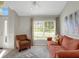 Relaxing living room with large windows and ample natural light at 336 Del Sol Ave, Davenport, FL 33837