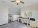 Upstairs loft office features a desk, storage, and a view of the stairs at 336 Del Sol Ave, Davenport, FL 33837