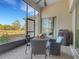 Covered patio with table and chairs, perfect for outdoor dining at 336 Del Sol Ave, Davenport, FL 33837