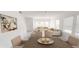 Dining area with a wooden table and neutral-toned seating at 381 Grand Pine Ln, St Cloud, FL 34771