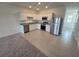 Modern kitchen with stainless steel appliances and white cabinets at 381 Grand Pine Ln, St Cloud, FL 34771