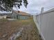 Backyard view of home and fence at 387 Blue Bayou Dr, Kissimmee, FL 34743