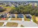 Overview of a house nestled in a residential neighborhood with surrounding homes visible at 442 Big Black Pl, Poinciana, FL 34759