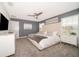 Main bedroom with king-size bed, TV, and ample natural light at 4835 Dedication St, Kissimmee, FL 34746