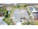 Aerial view showing house, solar panels, and pool at 520 Carlsbad Dr, Kissimmee, FL 34758