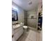 Bathroom with a shower/tub combo, granite vanity, and tile floors at 520 Carlsbad Dr, Kissimmee, FL 34758