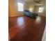 Bright bedroom with wood-look floors and a ceiling fan at 520 Carlsbad Dr, Kissimmee, FL 34758