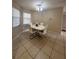 Bright dining room with white table and chairs at 520 Carlsbad Dr, Kissimmee, FL 34758