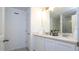 Double vanity bathroom with modern white cabinets at 607 Longboat Dr, Davenport, FL 33896
