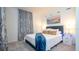 Spacious bedroom with gray headboard, gray carpet and window curtains at 607 Longboat Dr, Davenport, FL 33896