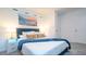 Bright bedroom with a comfortable queen-size bed and stylish decor at 607 Longboat Dr, Davenport, FL 33896