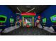 Fun game room with video games and comfortable seating at 607 Longboat Dr, Davenport, FL 33896
