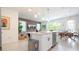 Modern kitchen with white cabinets, stainless steel appliances, and an island at 607 Longboat Dr, Davenport, FL 33896