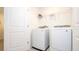 Convenient laundry room with washer and dryer at 607 Longboat Dr, Davenport, FL 33896