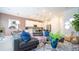 Open living space with gray sectional sofa and adjacent kitchen at 607 Longboat Dr, Davenport, FL 33896