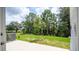 Private patio with a view of the backyard at 607 Longboat Dr, Davenport, FL 33896