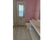 Bathroom features white vanity and access door to the backyard at 615 Gazelle Dr, Kissimmee, FL 34759