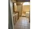 Bright bathroom featuring tub, shower, and vanity, all illuminated by a large arched window at 615 Gazelle Dr, Kissimmee, FL 34759