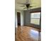 Bedroom with wood floors, closet and window allowing natural light at 615 Gazelle Dr, Kissimmee, FL 34759