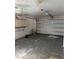 Spacious garage with an automatic door and ample storage space, ready for customization at 615 Gazelle Dr, Kissimmee, FL 34759