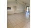 Spacious living room with light tile flooring and sliding glass doors at 615 Gazelle Dr, Kissimmee, FL 34759