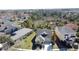 Aerial view showcasing house with well-maintained landscaping and lush green backdrop at 6826 Goldflower Ave, Harmony, FL 34773