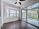 Bright dining area featuring a bay window, tile flooring, and sliding glass doors to a patio at 6826 Goldflower Ave, Harmony, FL 34773