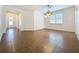 The dining room has a large tiled floor, a pendant light fixture and flows into the front entryway at 6826 Goldflower Ave, Harmony, FL 34773
