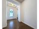 Hallway with a decorative glass front door and ceramic tile flooring at 6826 Goldflower Ave, Harmony, FL 34773