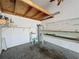This workshop area in garage has built in shelving and utility sink with connections for plumbing and electrical at 6826 Goldflower Ave, Harmony, FL 34773