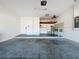 A spacious two car garage has built in shelving and utility sink with plumbing and electrical connections at 6826 Goldflower Ave, Harmony, FL 34773