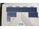 Detailed aerial view of a roof featuring solar panels at 6826 Goldflower Ave, Harmony, FL 34773