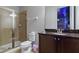 Bathroom with shower, toilet and granite vanity at 7617 Wilmington Loop, Kissimmee, FL 34747