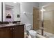 Bathroom with shower, toilet and granite vanity at 7617 Wilmington Loop, Kissimmee, FL 34747