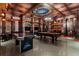 Finished basement featuring a game room with pool table, air hockey, and multiple TVs at 7617 Wilmington Loop, Kissimmee, FL 34747