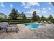 Private backyard oasis with a refreshing pool and lounge chairs at 7617 Wilmington Loop, Kissimmee, FL 34747