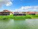 House with large screened patio and lake view at 870 Spinnaker Way, Kissimmee, FL 34746