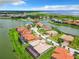 Upscale neighborhood featuring waterfront homes and lush landscaping at 870 Spinnaker Way, Kissimmee, FL 34746