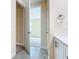 Bathroom with grey tile shower and white vanity at 870 Spinnaker Way, Kissimmee, FL 34746