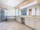 Elegant bathroom with double vanity, soaking tub, and shower at 870 Spinnaker Way, Kissimmee, FL 34746