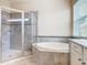 Bathroom with walk-in shower and soaking tub at 870 Spinnaker Way, Kissimmee, FL 34746