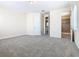 Spacious bedroom with carpet and access to bathroom at 870 Spinnaker Way, Kissimmee, FL 34746