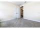 Bedroom with double doors and neutral carpeting at 870 Spinnaker Way, Kissimmee, FL 34746