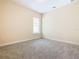 Bright bedroom with neutral carpeting at 870 Spinnaker Way, Kissimmee, FL 34746