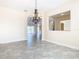 Spacious dining room with chandelier and view to Gathering room at 870 Spinnaker Way, Kissimmee, FL 34746