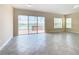 Bright dining room with tile floors and sliding doors leading to a patio with lake view at 870 Spinnaker Way, Kissimmee, FL 34746